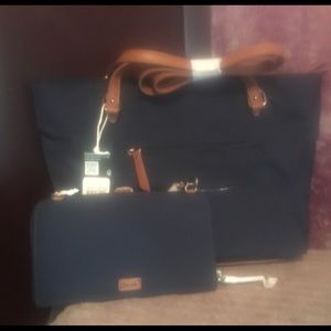 The sak navy blue bag and wallet brand new still in pkg